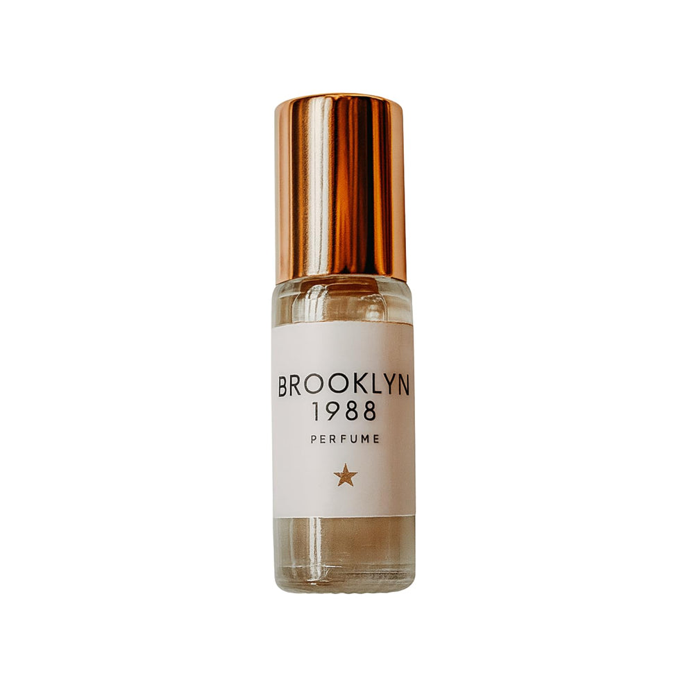Olivine Atelier Brooklyn 1988 mini perfume oil bottle pour offering a long-lasting aroma.