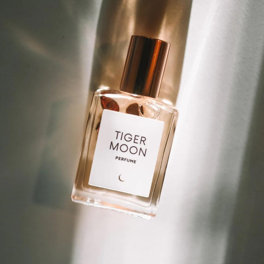 Olivine Atelier Tiger Moon bottle pour highlights long-lasting aromatherapy fragrance.