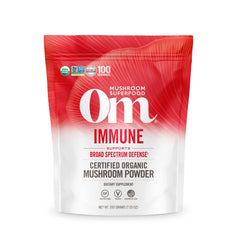 OM Mushroom Superfood powder in a pouch for daily immune wellness.