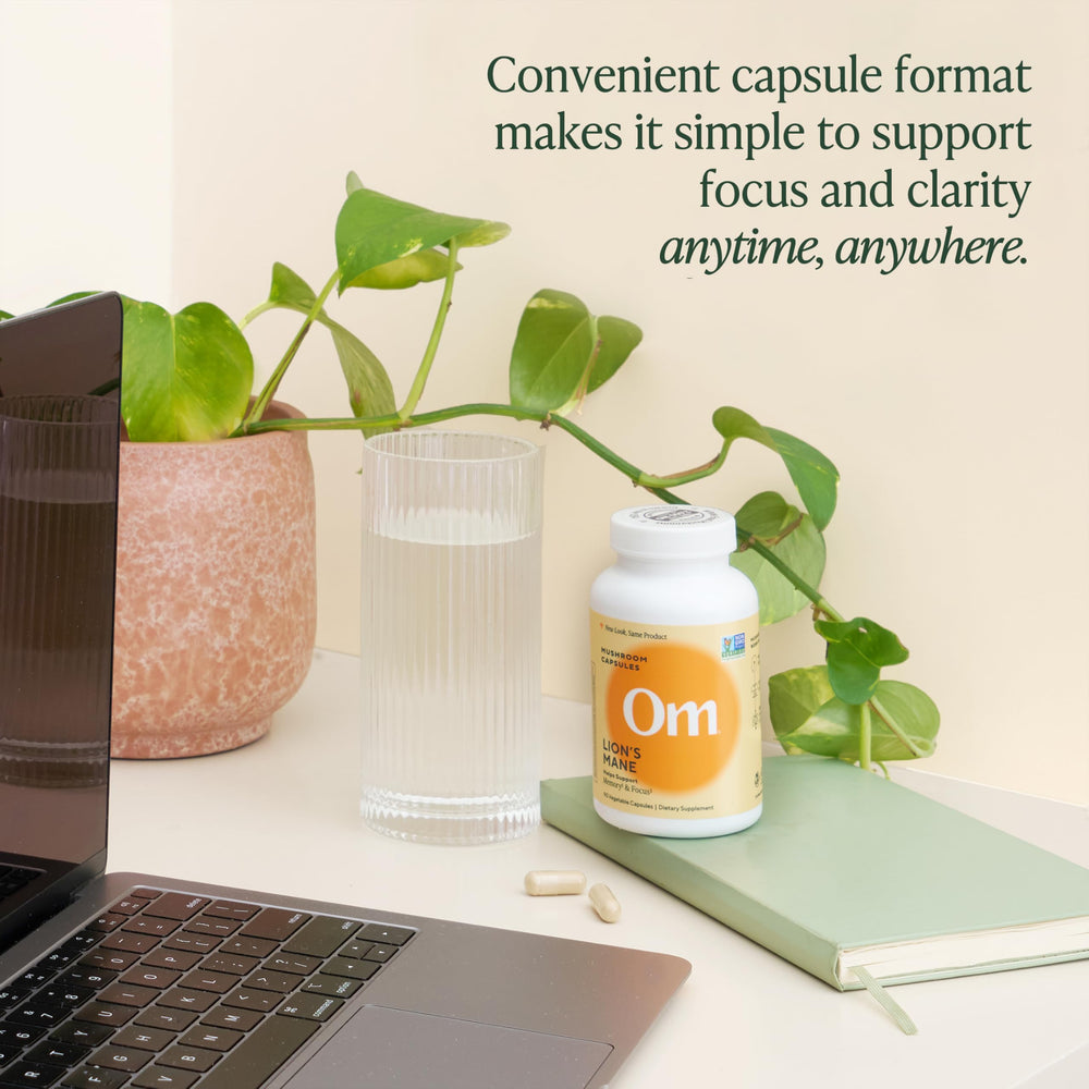 OM Mushroom Lion's Mane capsules in hand for scale during use