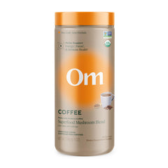 OM Mushroom Superfood instant coffee canister with organic arabica and mushroom blend boosts morning focus.