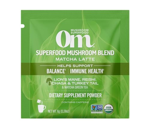 Steaming OM Mushroom Superfood Matcha Latte Blend cup showing creamy texture.