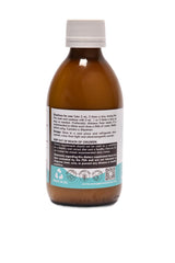 OM Organic Minerals bottle pour showing easy dosing for tasteless intake.