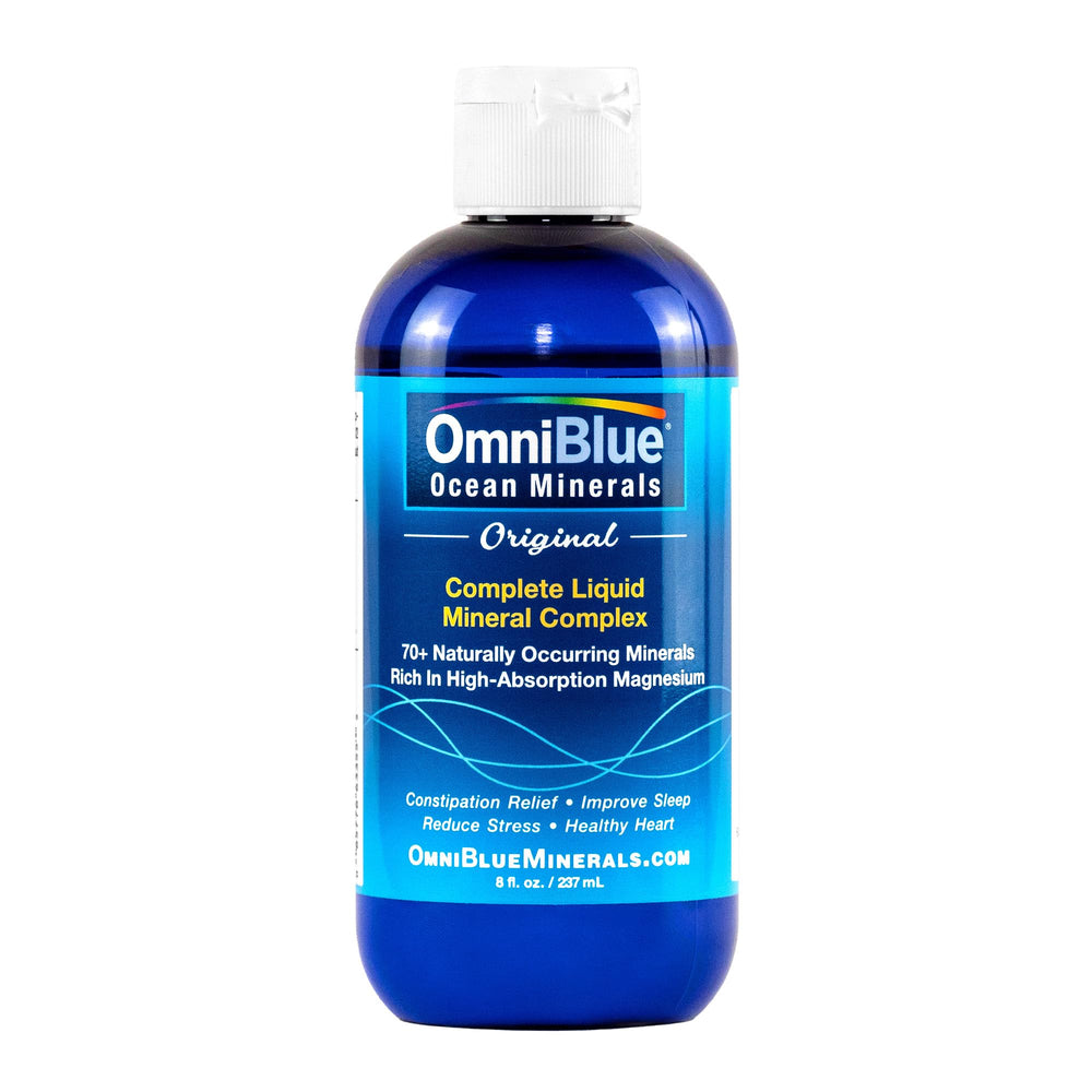 Pouring OmniBlue Ocean Minerals into water to support hydration and electrolyte balance.