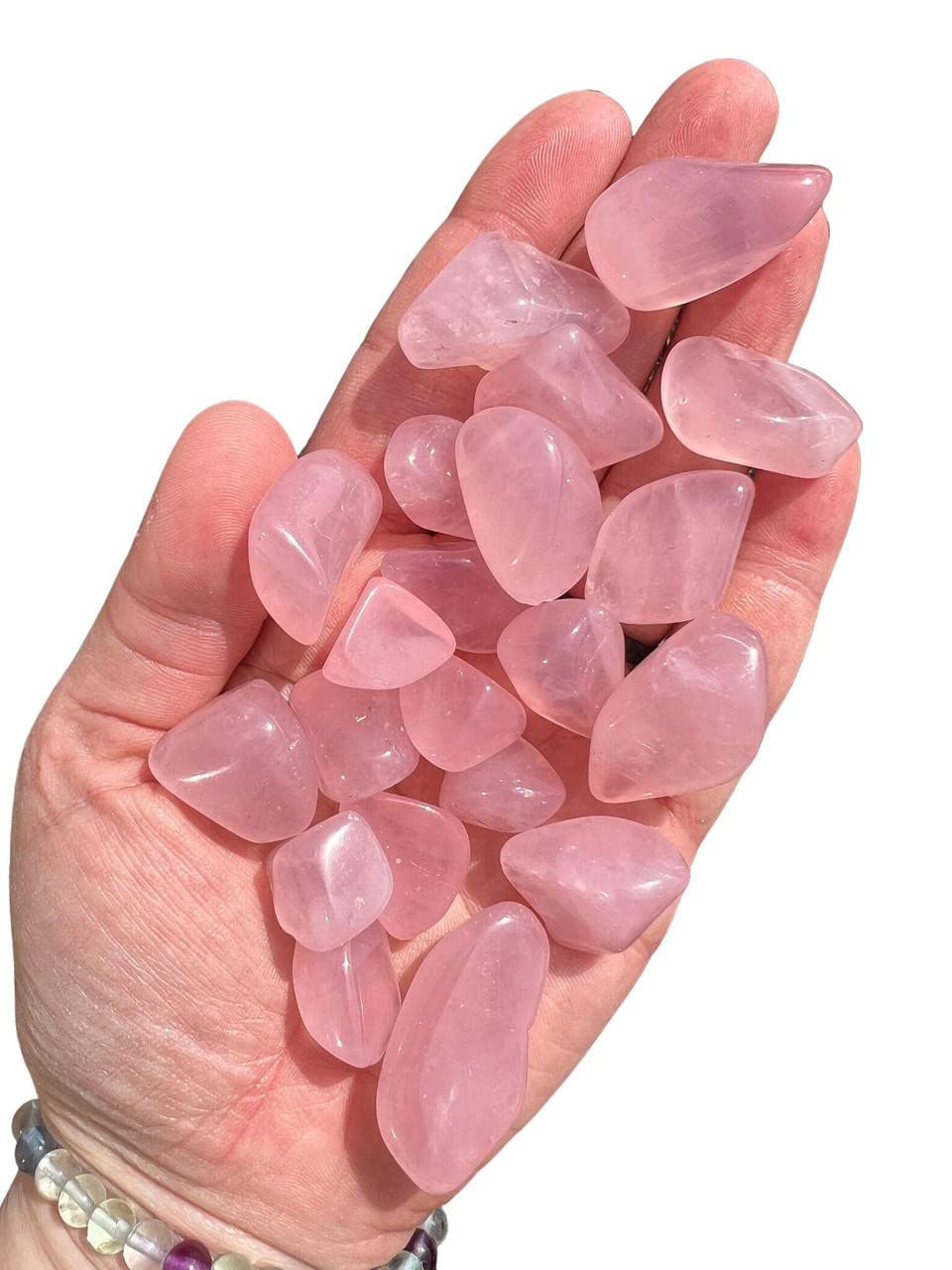 Opulent Crystals rose quartz tumbled stones in natural pink hues for emotional balance.