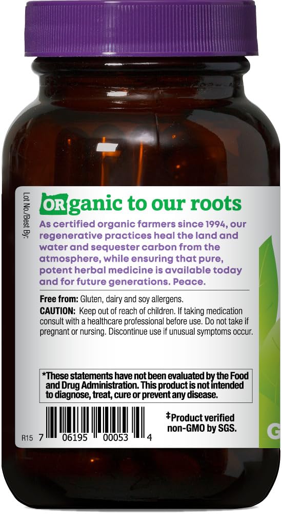 Capsules ready for daily intake beside a glass of water.
