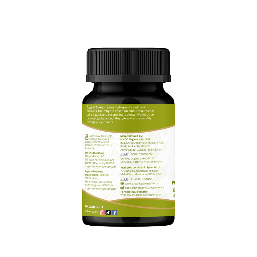 Organic Spree Amla tablets beside a glass of water for daily routine