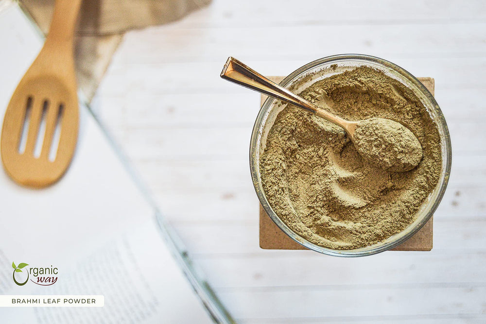 Organic Way Brahmi leaf powder with spoon ready for smoothie blends