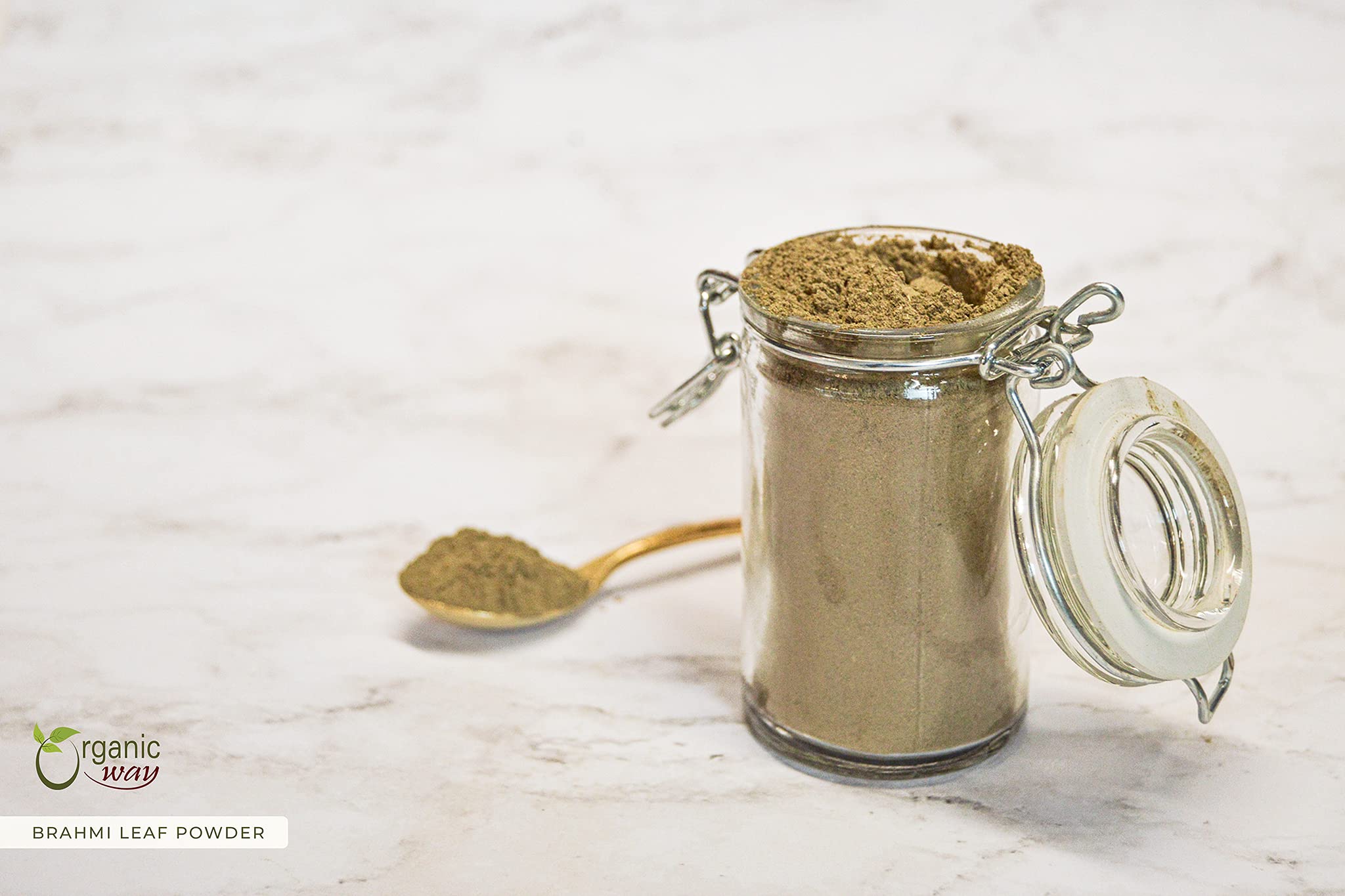 Organic Way Brahmi powder heap on a clean surface communicates natural quality