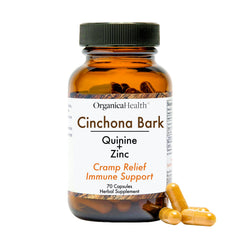 OrganicaHealth Quinine capsules bottle on a counter suggests leg cramps relief possibilities.