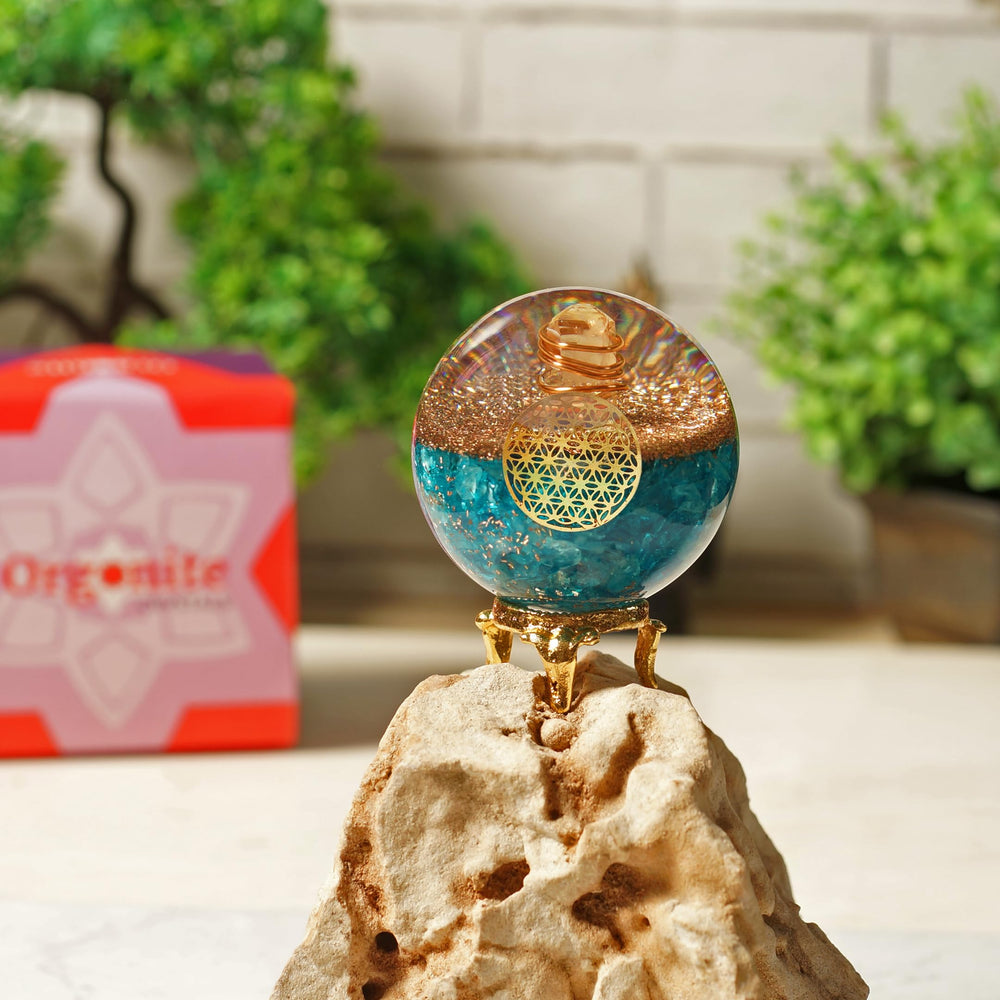 Orgonite Crystal Blue Aquamarine Ball on a shelf elevates decor with positive energy.