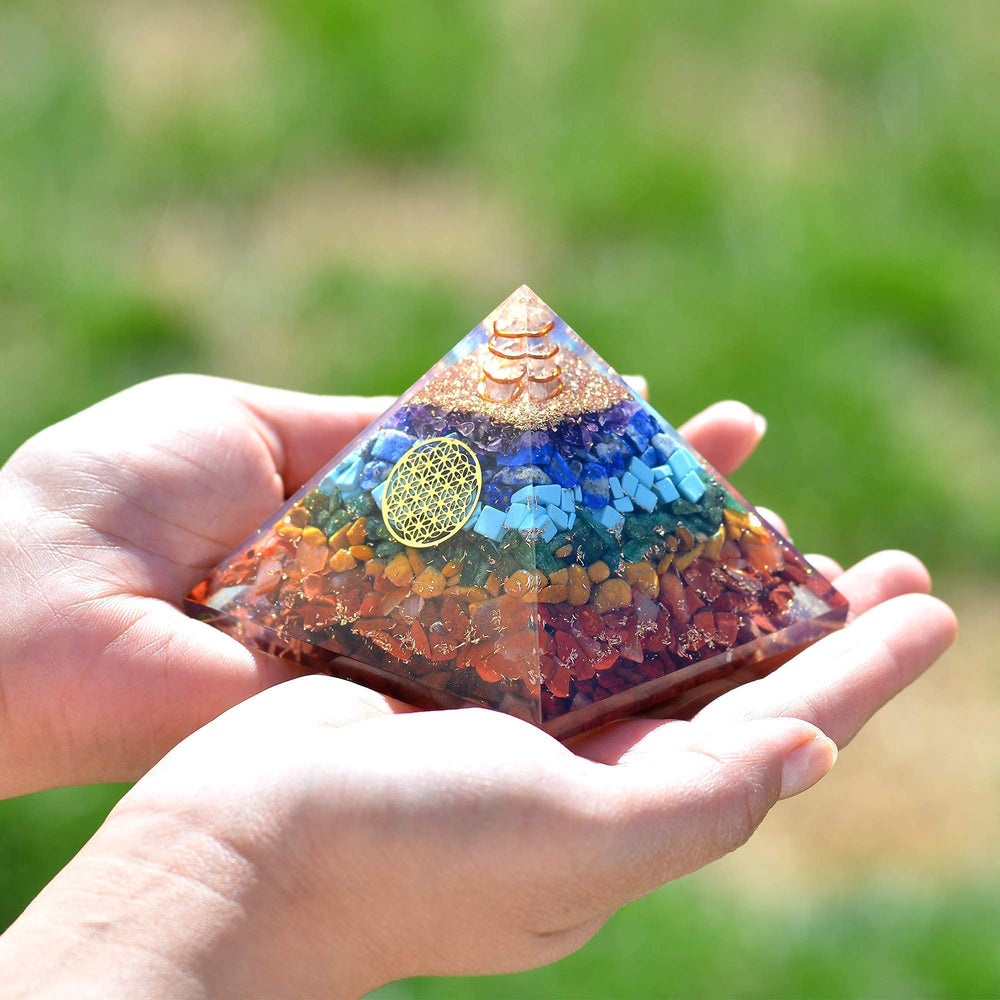 Orgonite Crystal Seven Chakra Pyramid on desk supports mindful focus