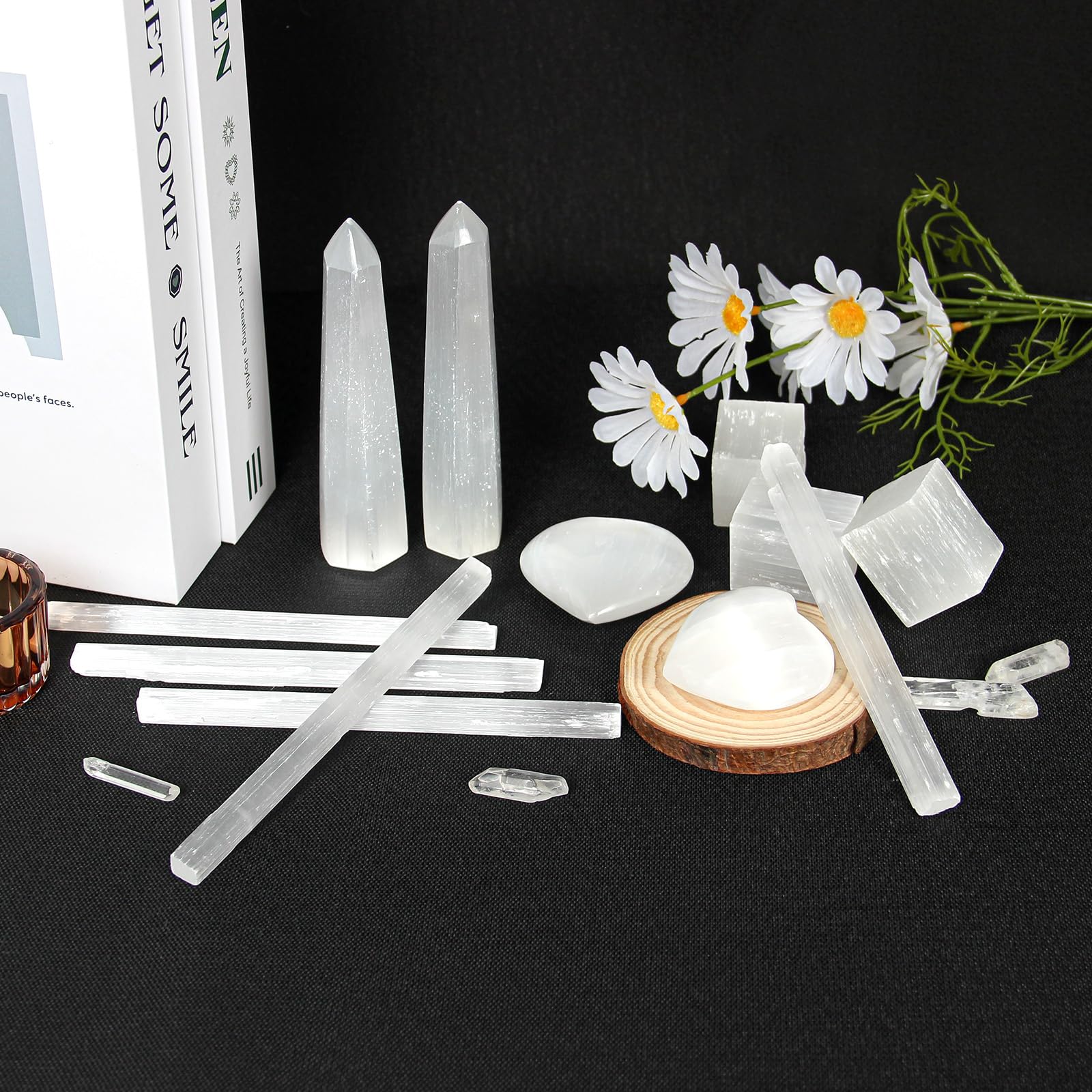 Orientrea chakra wand beside candle, a calming meditation aid.