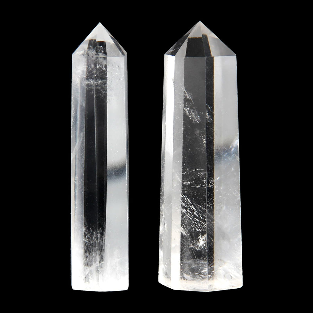 Orientrea clear quartz wand close-up tip, polished facets for tactile relaxation.