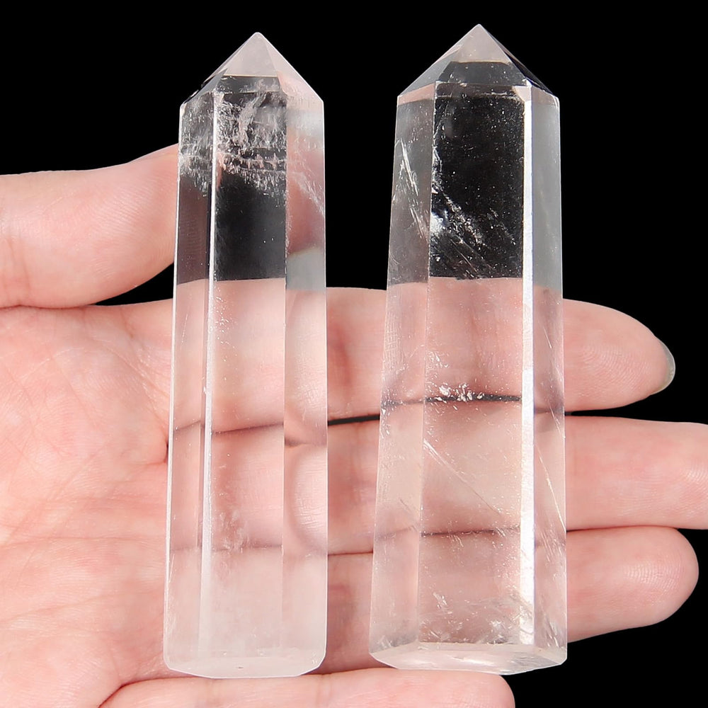 Orientrea clear quartz wand pair for meditation and focus, natural stones in a refined display.