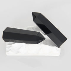 Orientrea Obsidian Wand polished facets reflect light for grounding during practice.