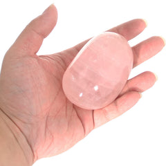 Orientrea Rose Quartz palm stone in hands during relaxation ritual promotes inner peace and balance.