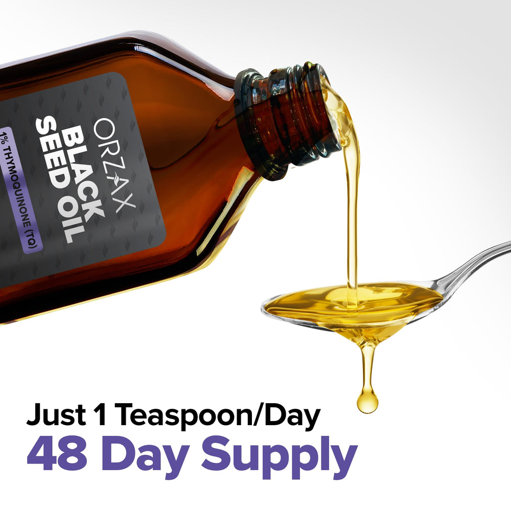ORZAX Black Seed Oil drops on hand – convenient for under-tongue use.