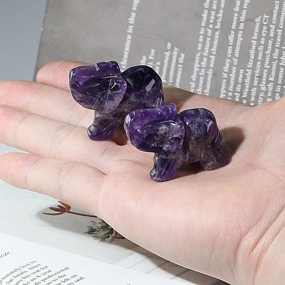 Ouubuuy amethyst elephant car ornament to foster calm during drives.