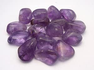 Pachamama Essentials Amethyst stones in a tray, supporting restful sleep and serene dreams.