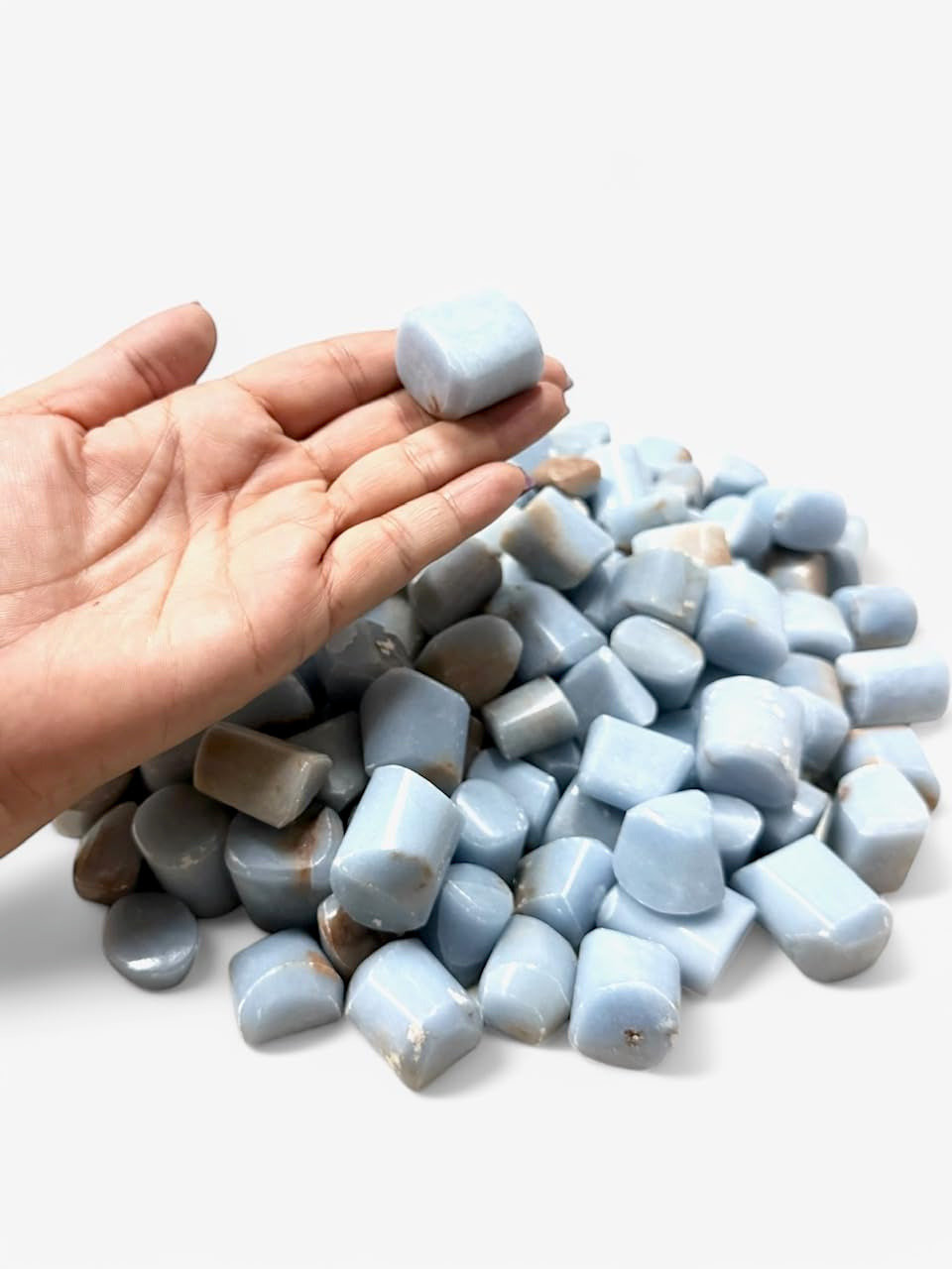 Pachamama Essentials Angelite tumbled stone round used for spiritual connection and energy balance.