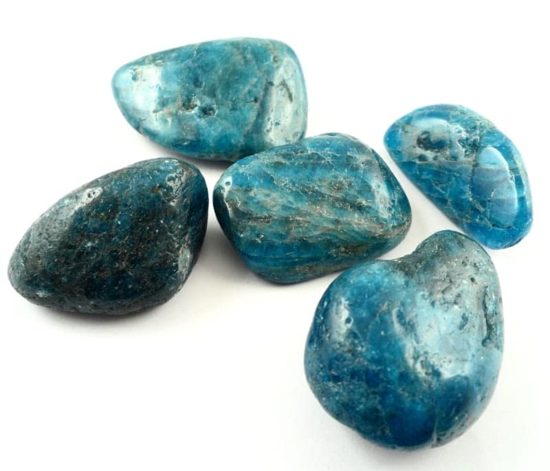 Pachamama Essentials Blue Apatite on wood evokes clarity and creative potential.