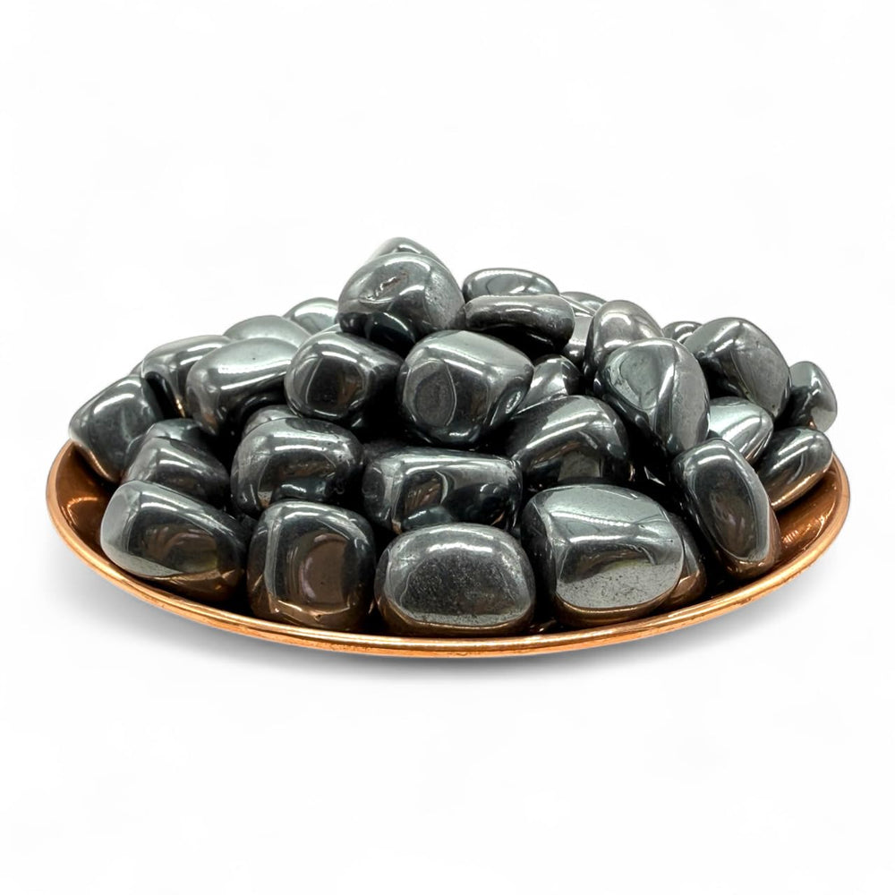 Pachamama Essentials hematite tumbled stone for grounding during meditation.