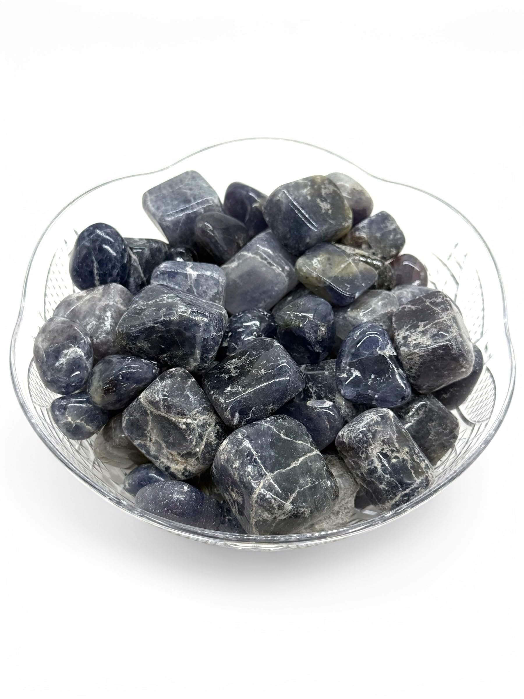 Pachamama Essentials Iolite tumbled stones show natural color and shape variations.