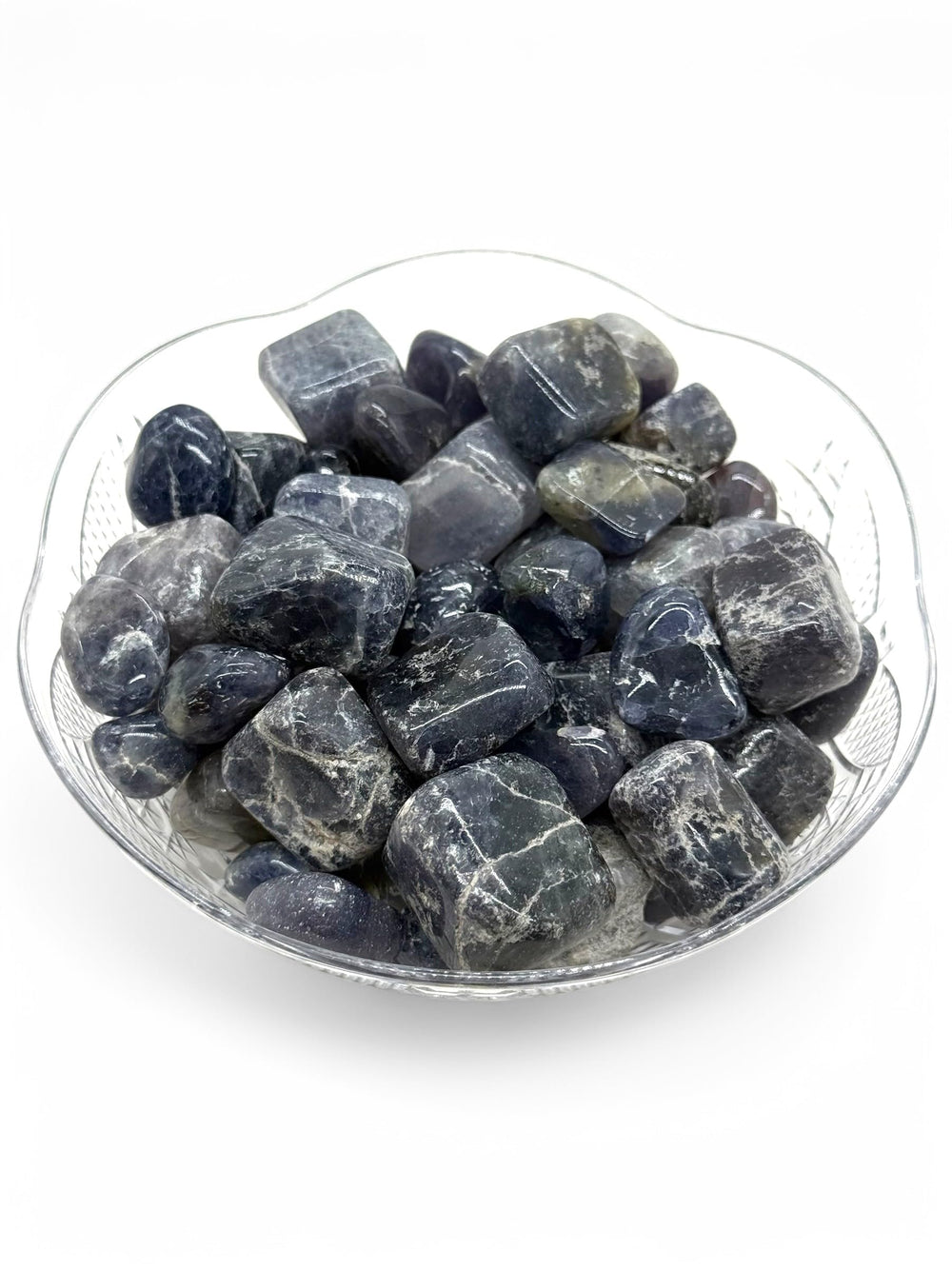 Pachamama Essentials Iolite tumbled stones show natural color and shape variations.