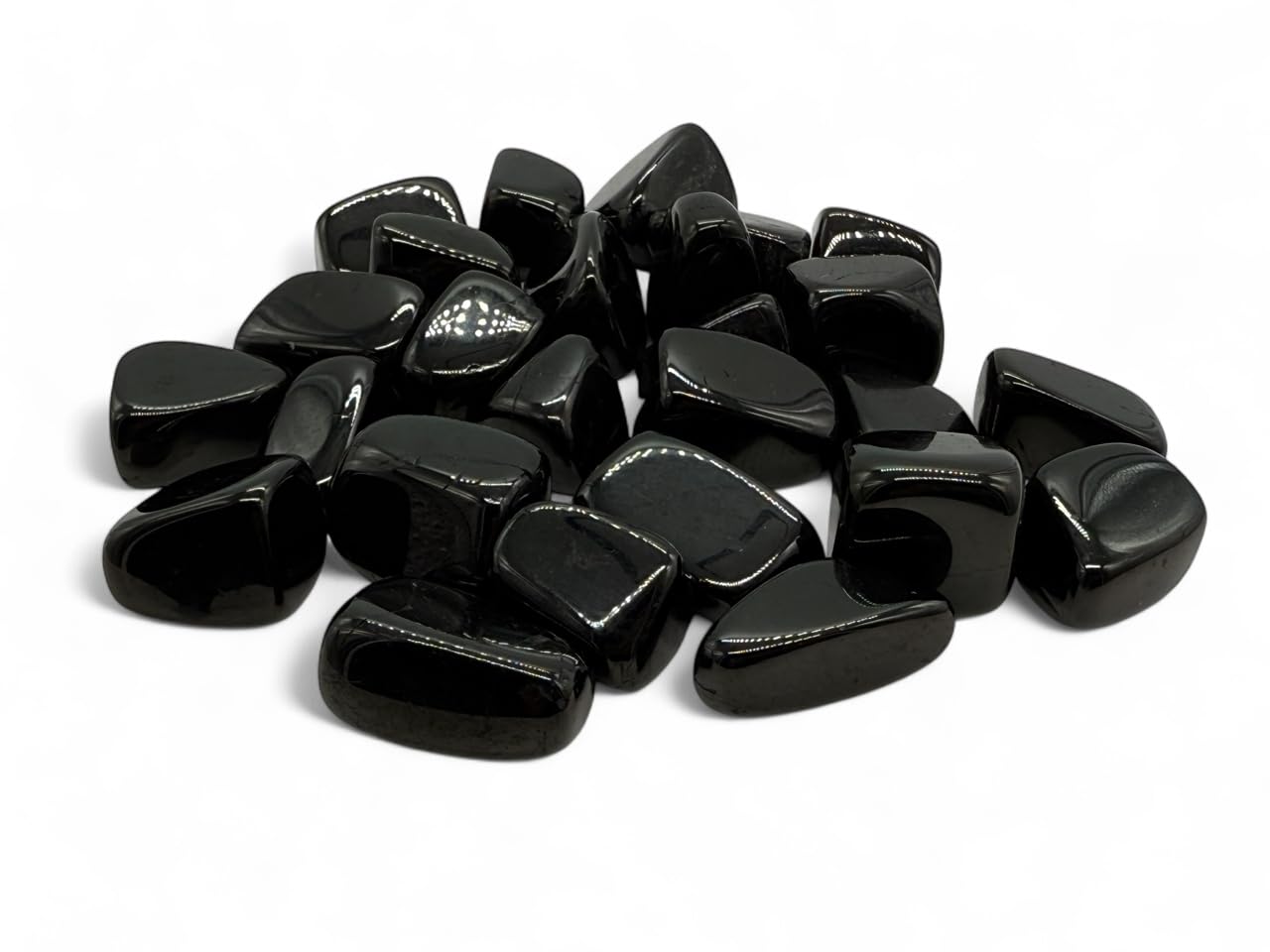 Pachamama Essentials Jet tumbled stone round 3-pack for grounding and aura cleansing.