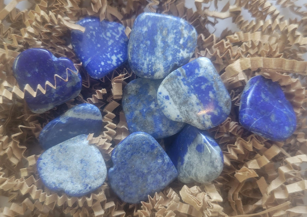 Pachamama Essentials lapis heart palm stone for meditation and energy focus.