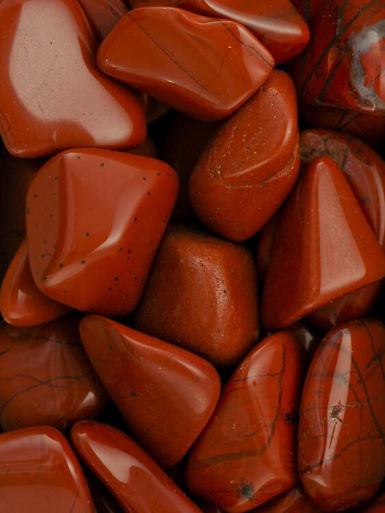 Pachamama Essentials Red Jasper stones arranged for calm desk décor and balance.