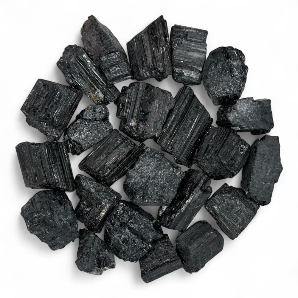 Pachamama Essentials rough black tourmaline stones for grounding and focused work.