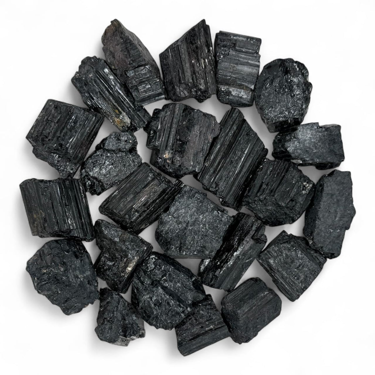 Pachamama Essentials rough black tourmaline stones for grounding and focused work.