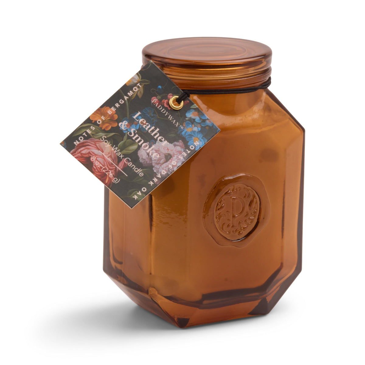 Paddywax Botanica candle in an embossed glass jar adds warm ambiance to any room.