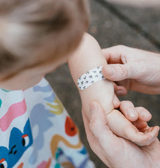 Patch hypoallergenic breathable fabric bandage on active child.