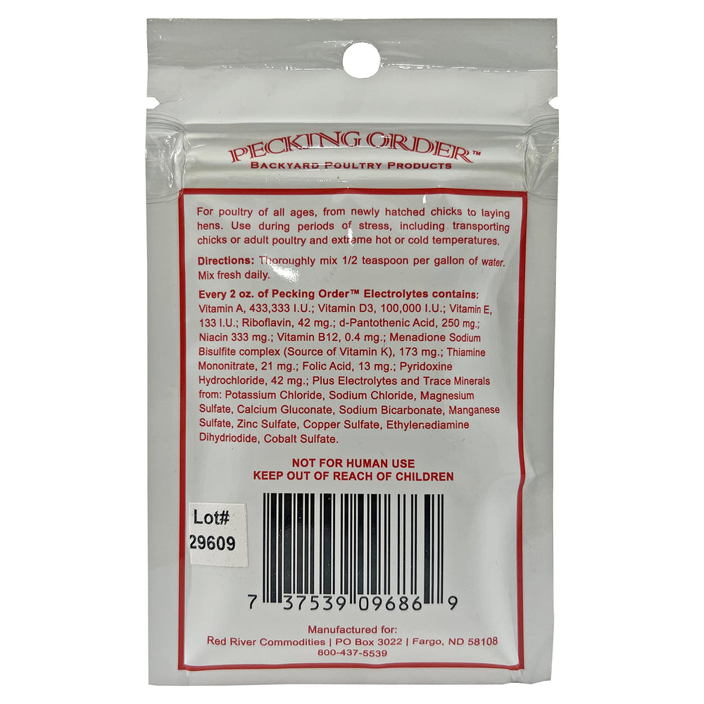 Pecking Order label closeup yellow highlights vitamin boosts for growing and laying poultry.