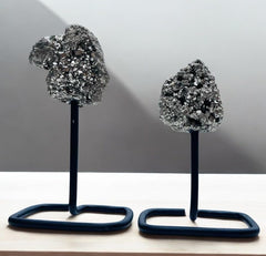 Peru pyrite geode cluster shines under light for captivating shelf decor.