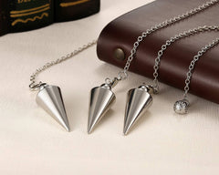 PESOENTH silver spiral coil accent visual for focus during energy work.