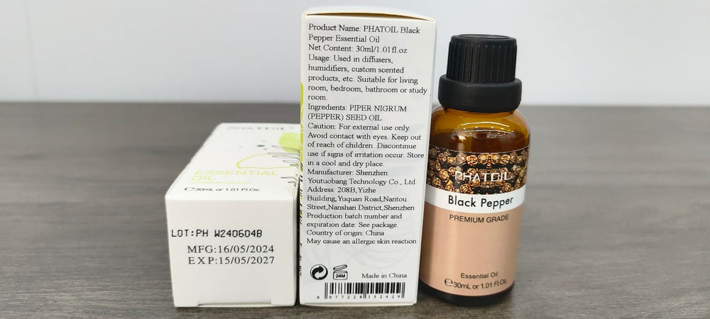 PHATOIL Black Pepper essential oil packaging display on a shelf