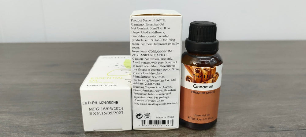 PHATOIL Cinnamon essential oil bottle labeled for easy storage.