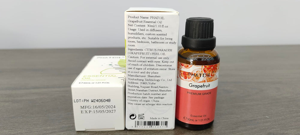 PHATOIL Grapefruit Essential Oil amber bottle closeup showing UV protection.