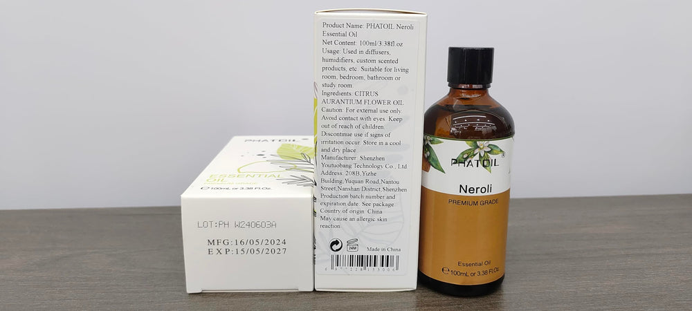 Close-up of PHATOIL Neroli oil bottle and dropper.