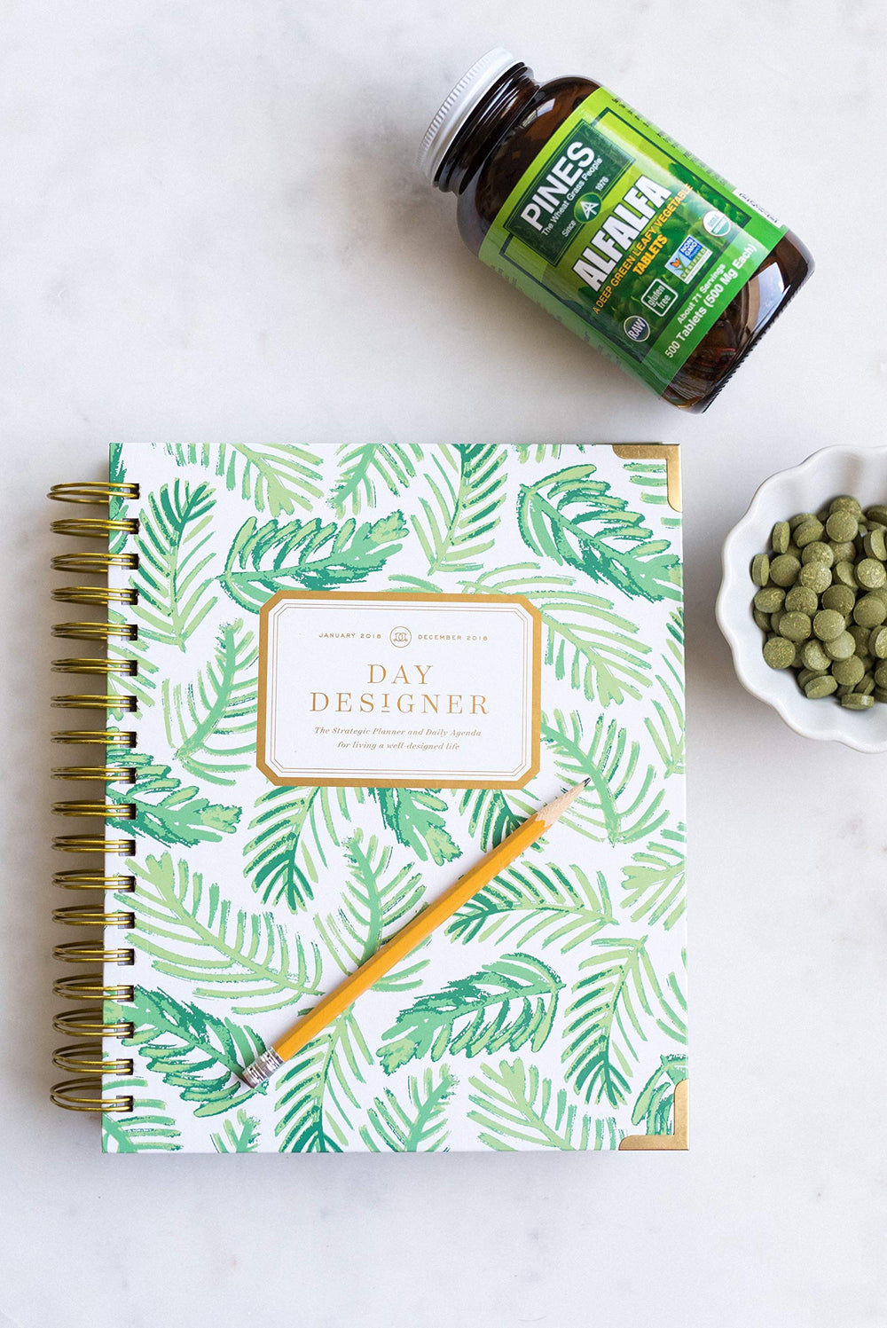 PINES Organic Barley Grass in a glass of juice, plant-based boost