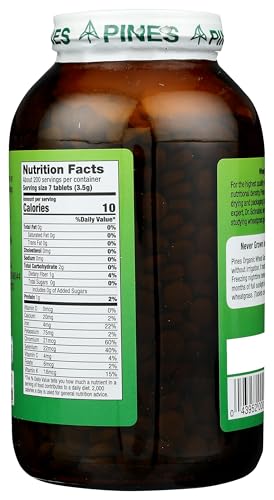 Pines Wheat Grass Tablets being poured into a glass for easy daily greens.
