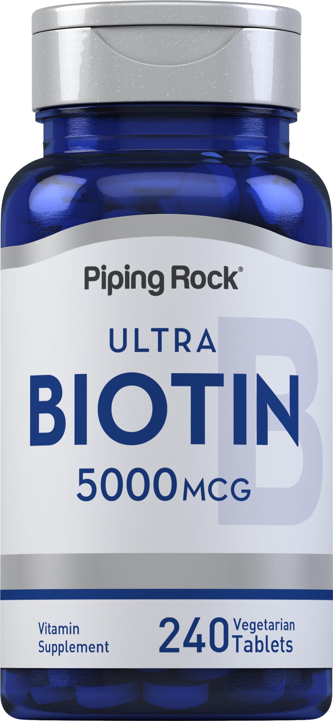 Piping Rock Biotin 5000mcg tablets on a clean surface for beauty support.