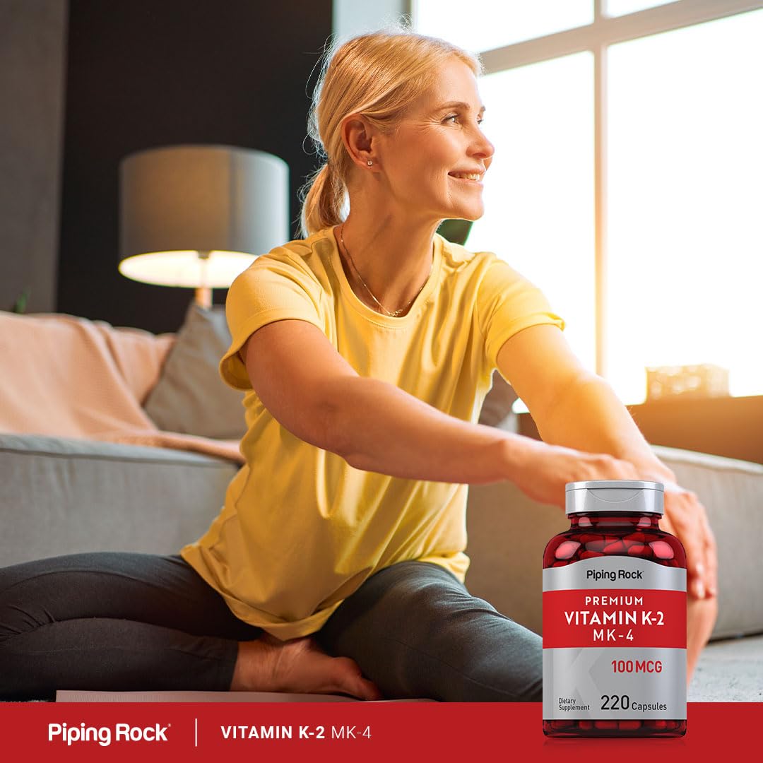 Piping Rock Vitamin K2 MK4 capsules arranged on a tray; long-lasting supply