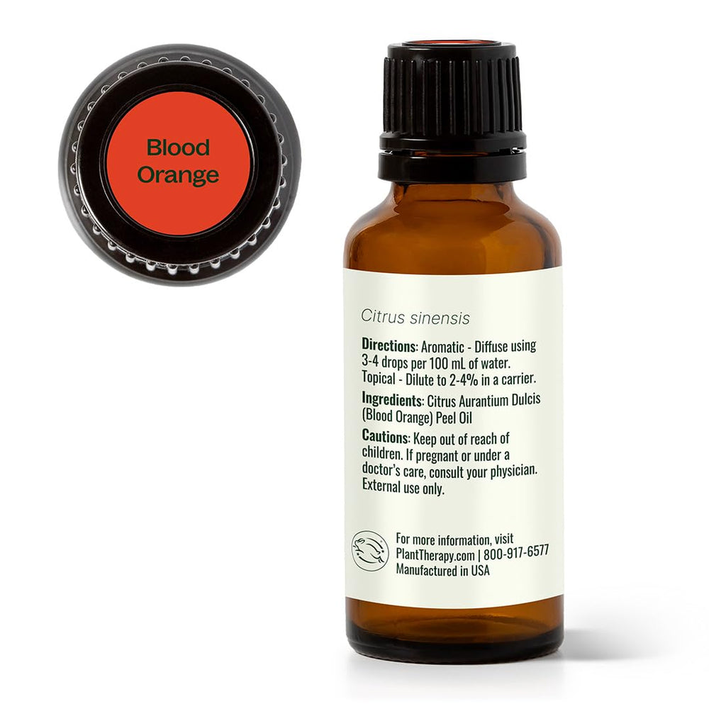 Label close-up showing product branding and purity claims on Plant Therapy Blood Orange oil.
