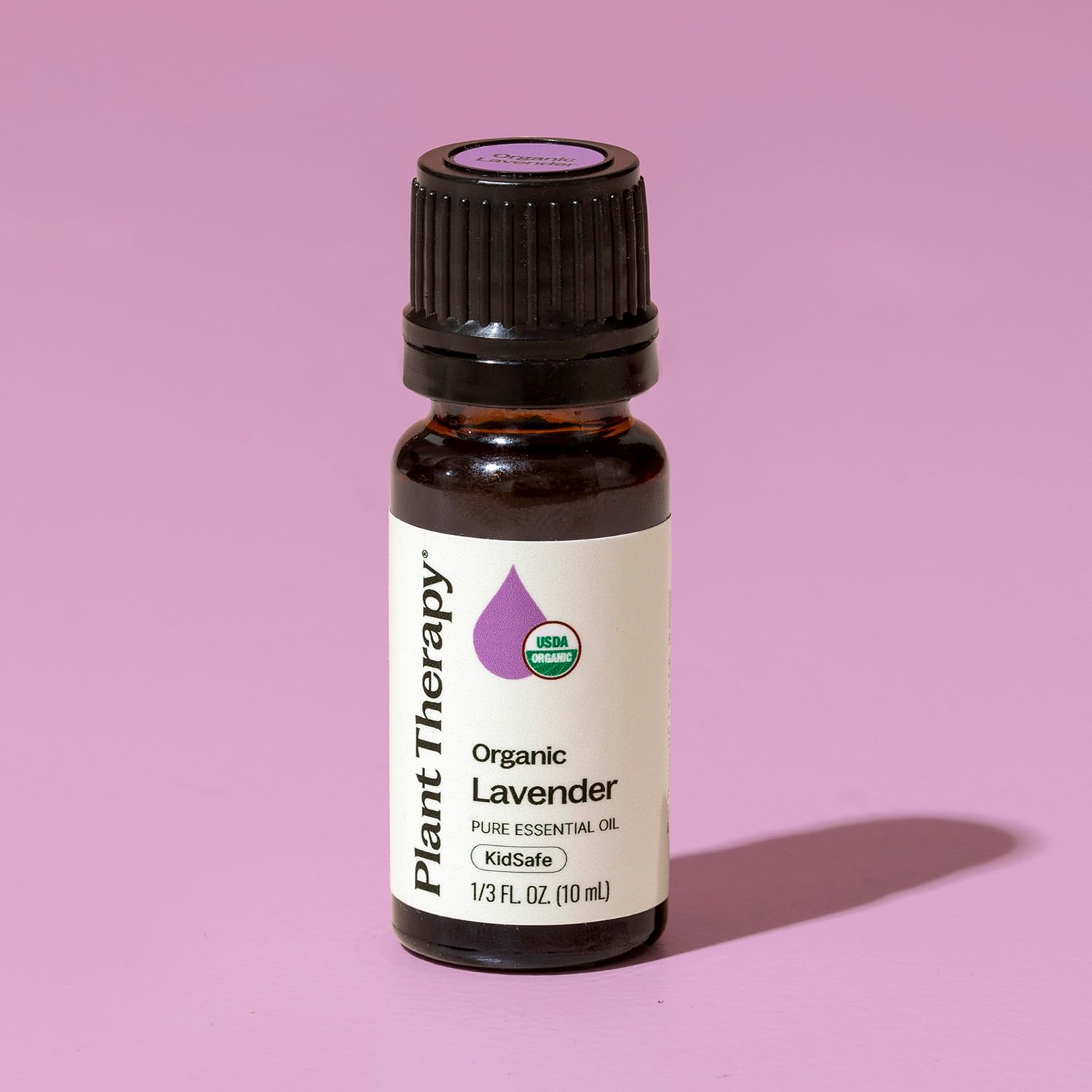 Plant Therapy Lavender Oil bottle beside natural ingredients for aromatherapy blends.
