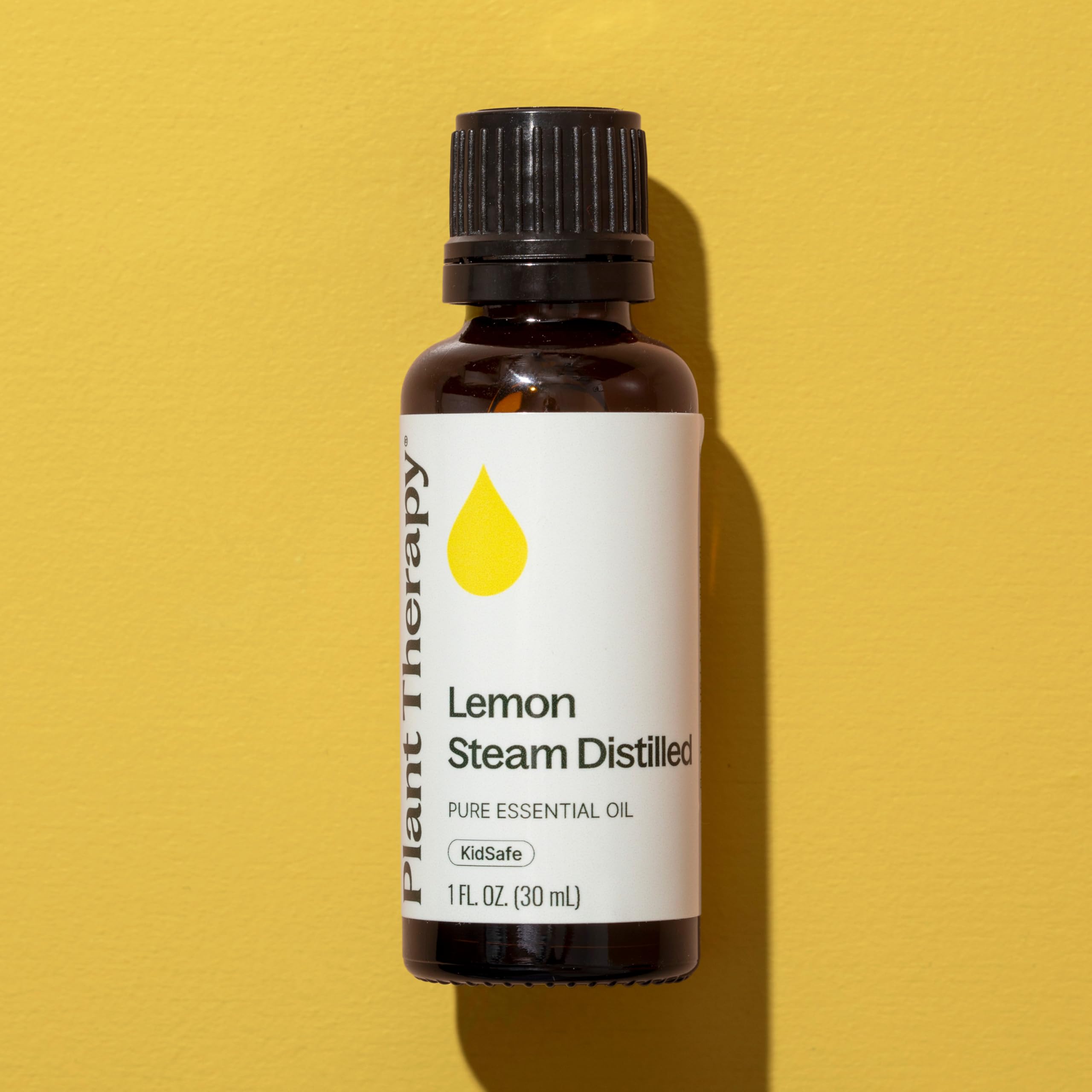 Plant Therapy lemon oil dropper beside bottle for easy blending.